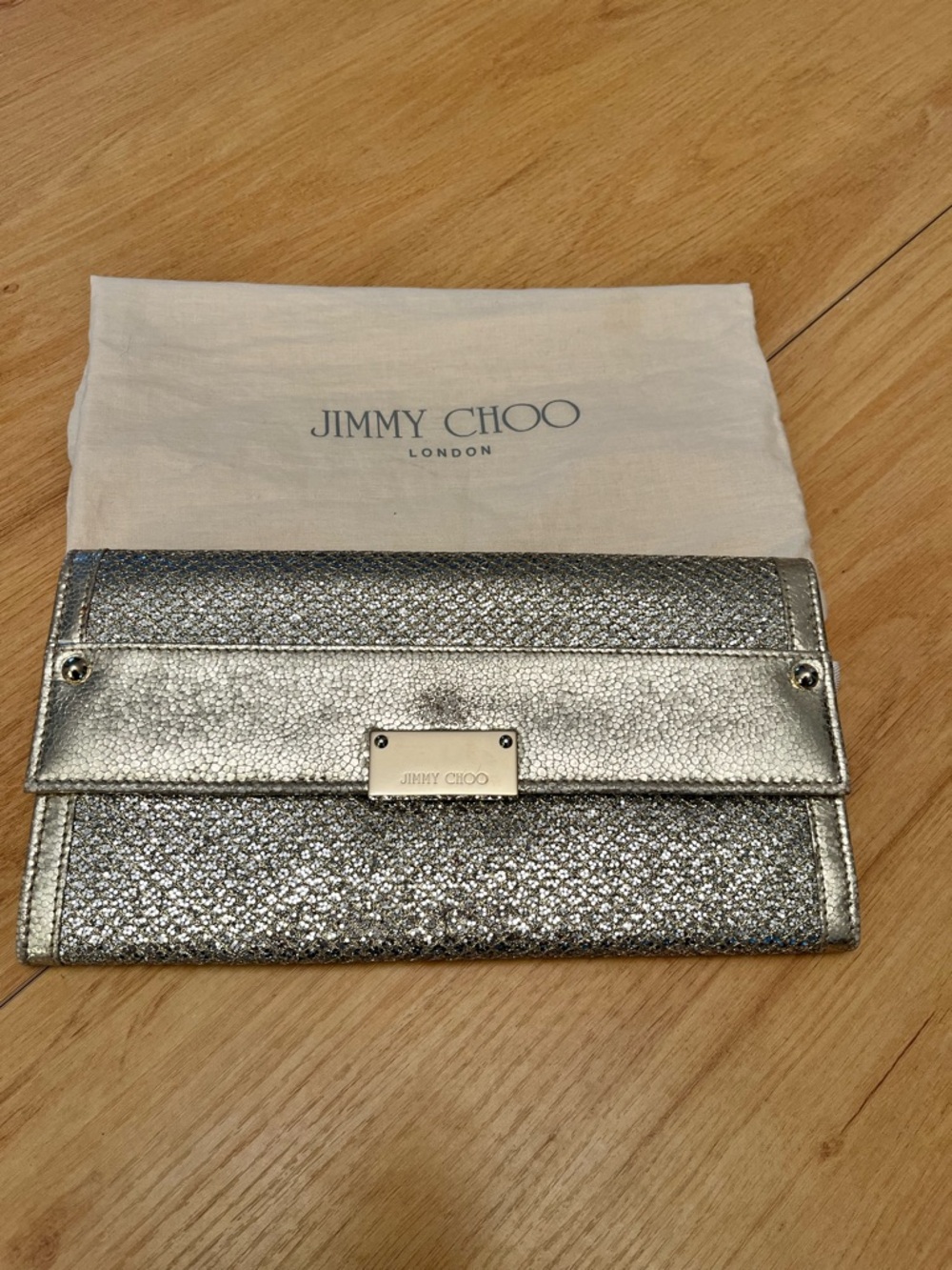 Authentic Jimmy Choo Metallic Silver Fold-Over Clutch with Logo Plate